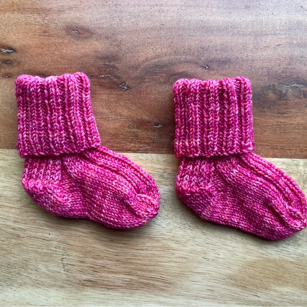 Last chance! 
Hand knit Baby Socks—that will actually stay on your baby’s feet!